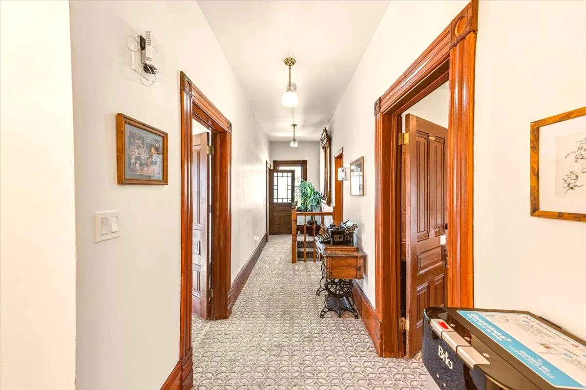 The upstairs hallway with original doors and trim
